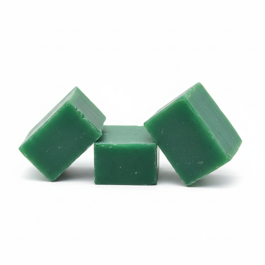 Green soap bars on white background
